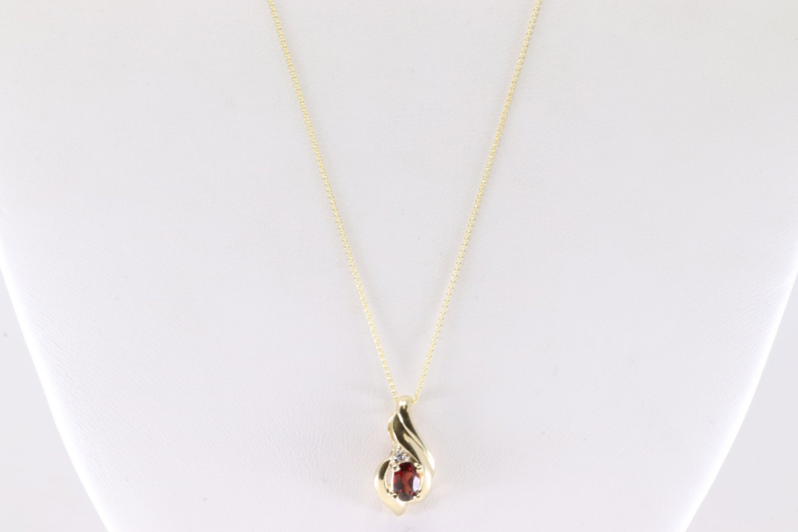 Garnet & Diamond Pendant / Necklace 10Kt.: Ladies 10Kt Yellow Gold Garnet & Diamond Pendant / Necklace. This Pendant has Garnet with one Diamond and 14k Necklace. Necklace length: 22.00" Total weight: 2.70 Grams.