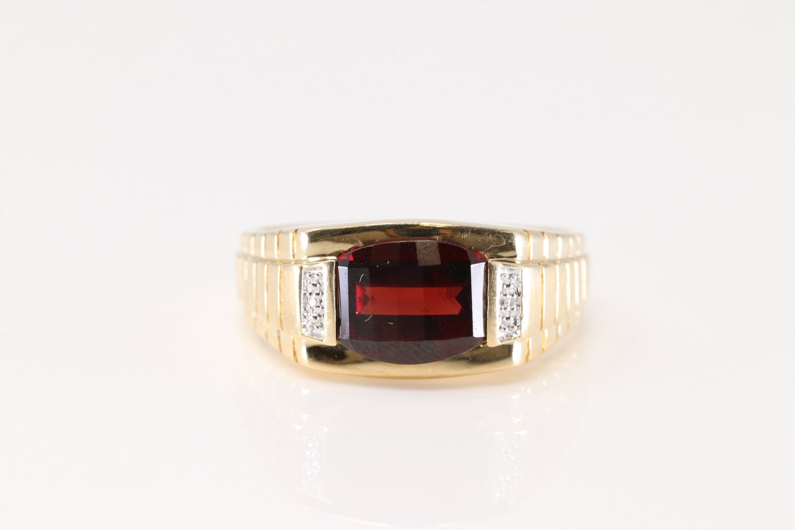 Elegant Garnet & Diamond Ring 10Kt.: 10Kt Yellow Gold Garnet & Diamond Ring. This Elegant Ring has Garnet Gemstone with 2 Sparkling Diamonds. Ring size: 10.50. Total weight: 4.80 Grams.