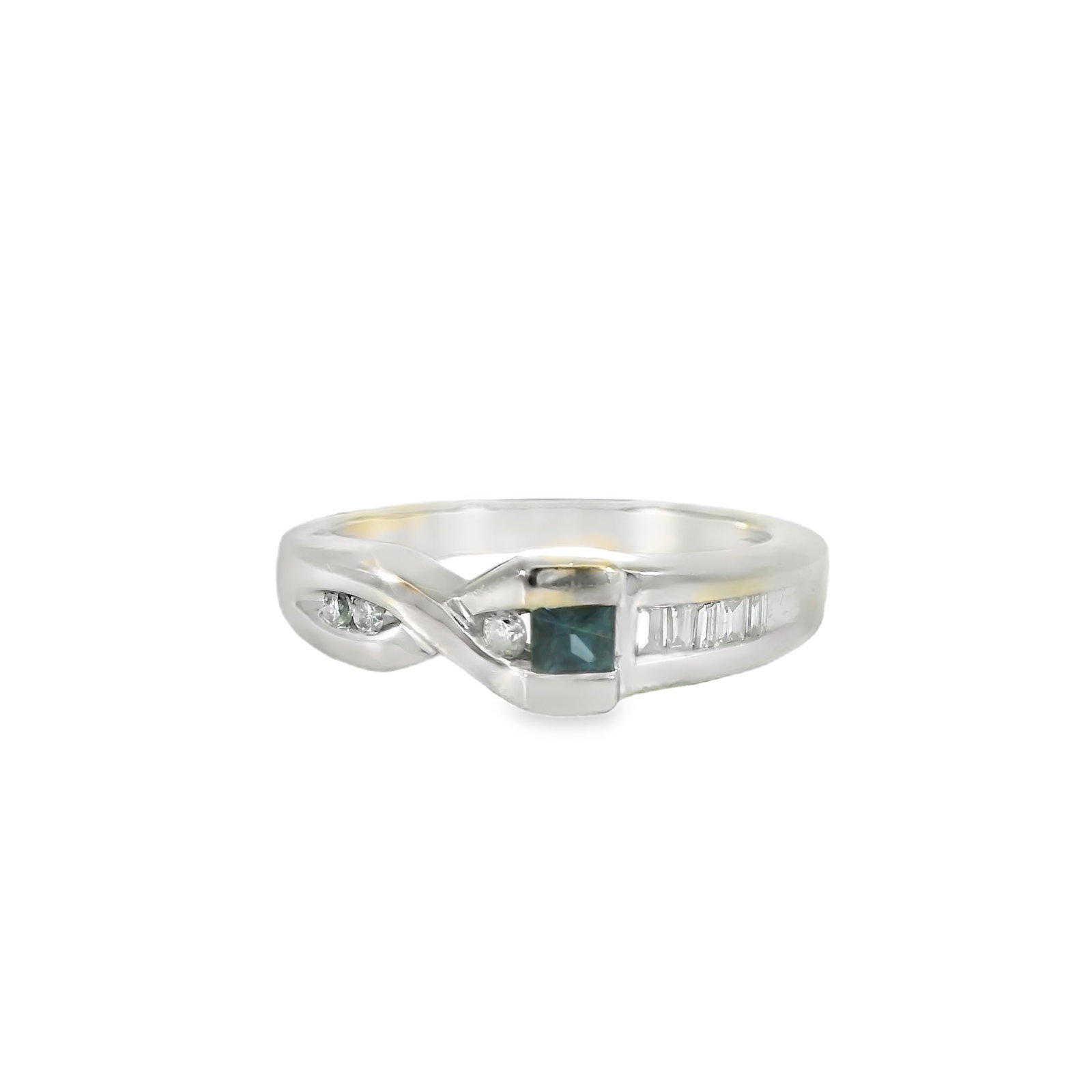 Sapphire & Diamond Ring 14Kt.: 14Kt White Gold Sapphire & Diamond Ring. This exquisite ring features a stunning blue sapphire gemstone at its center, flanked by a series of sparkling clear diamonds. Its sleek and modern design