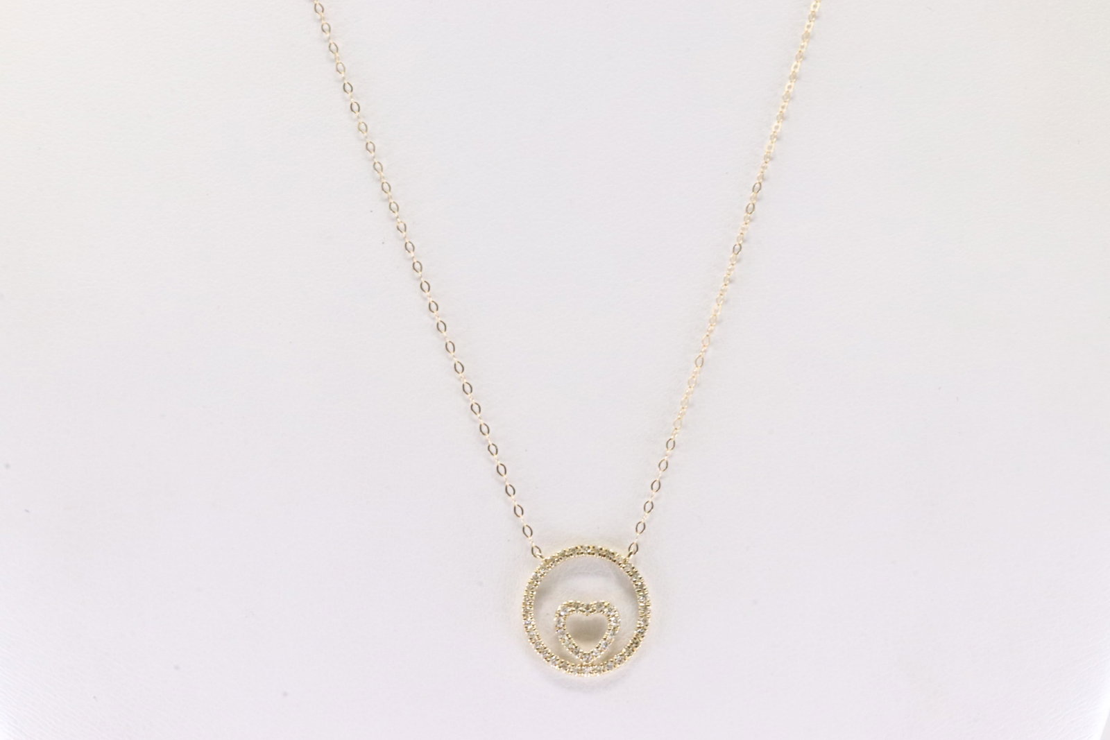 Diamond Necklace 10Kt.: Ladies 10Kt Yellow Gold Doiamond Necklace. This Necklace has Charming Heart & Circle Charm with Sparkling Diamonds. Diamonds weight: 0.25ctw. Necklace length: 18.00"