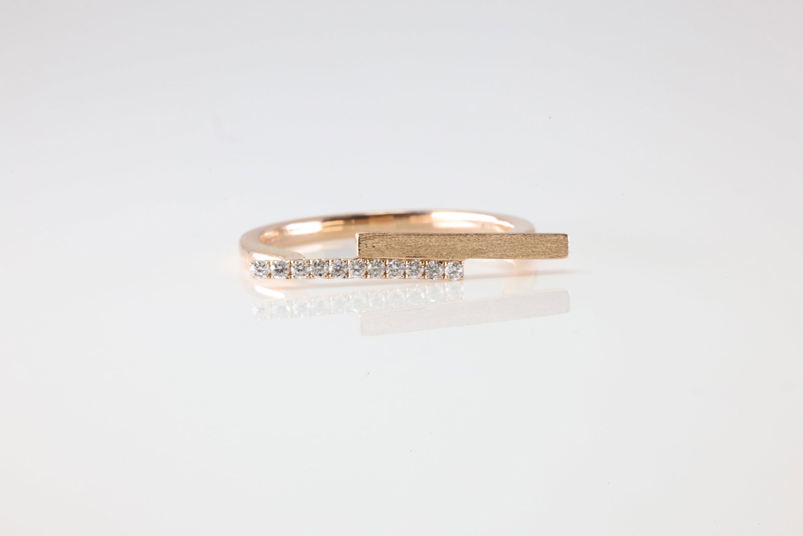 Diamond Ring 14Kt.: Ladies 14Kt Rose Gold Diamond Ring. This Ring Is A Contemporary Fashion Band With 11 Round Sparkling Diamonds. Ring Size: 7.00.