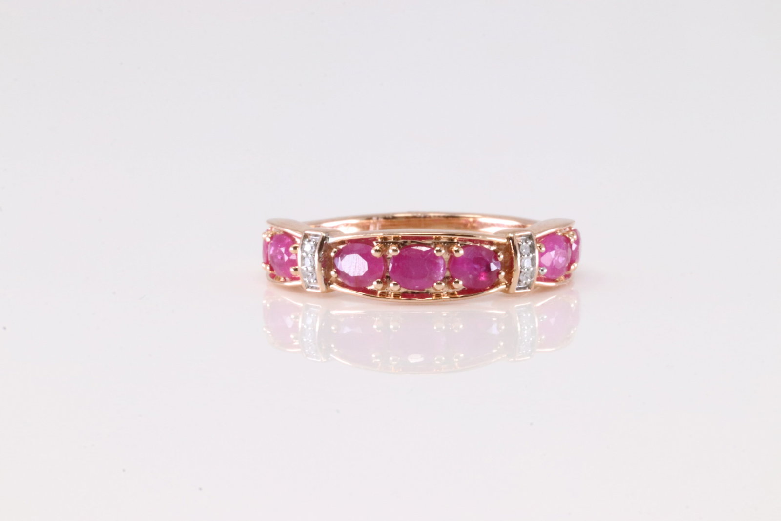 Ruby & Diamond Ring 10Kt.: Ladies 10Kt Rose Gold Ruby & Diamond. This Elegant Ring has 7 Rubies with Sparkling Diamonds. Diamonds weight: 0.05ctw. Ring size: 7.75. Total weight: 3.40 Grams.