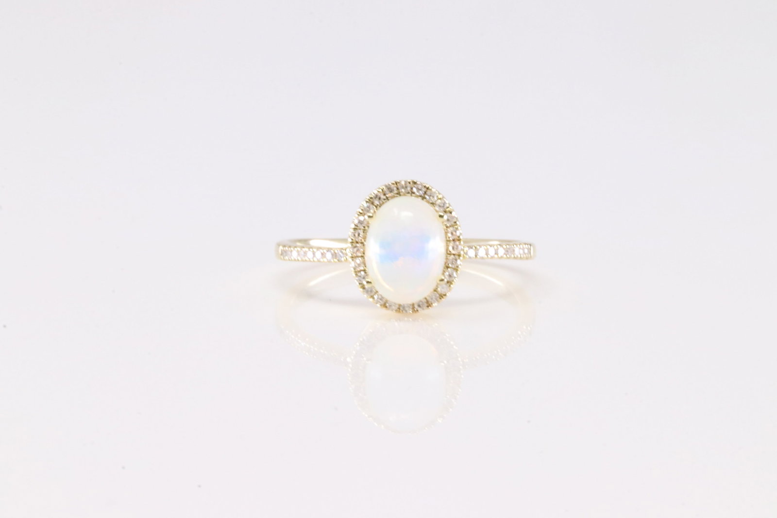 Opal & Diamond Ring 10Kt.: Ladies 10Kt Yellow Gold Opal & Diamond Ring. This Charming Ring has Opal Gemstone with Sparkling Diamonds. Diamonds weight: 0.25ctw. Ring size: 7.00. Total weight: 2.23 Grams.