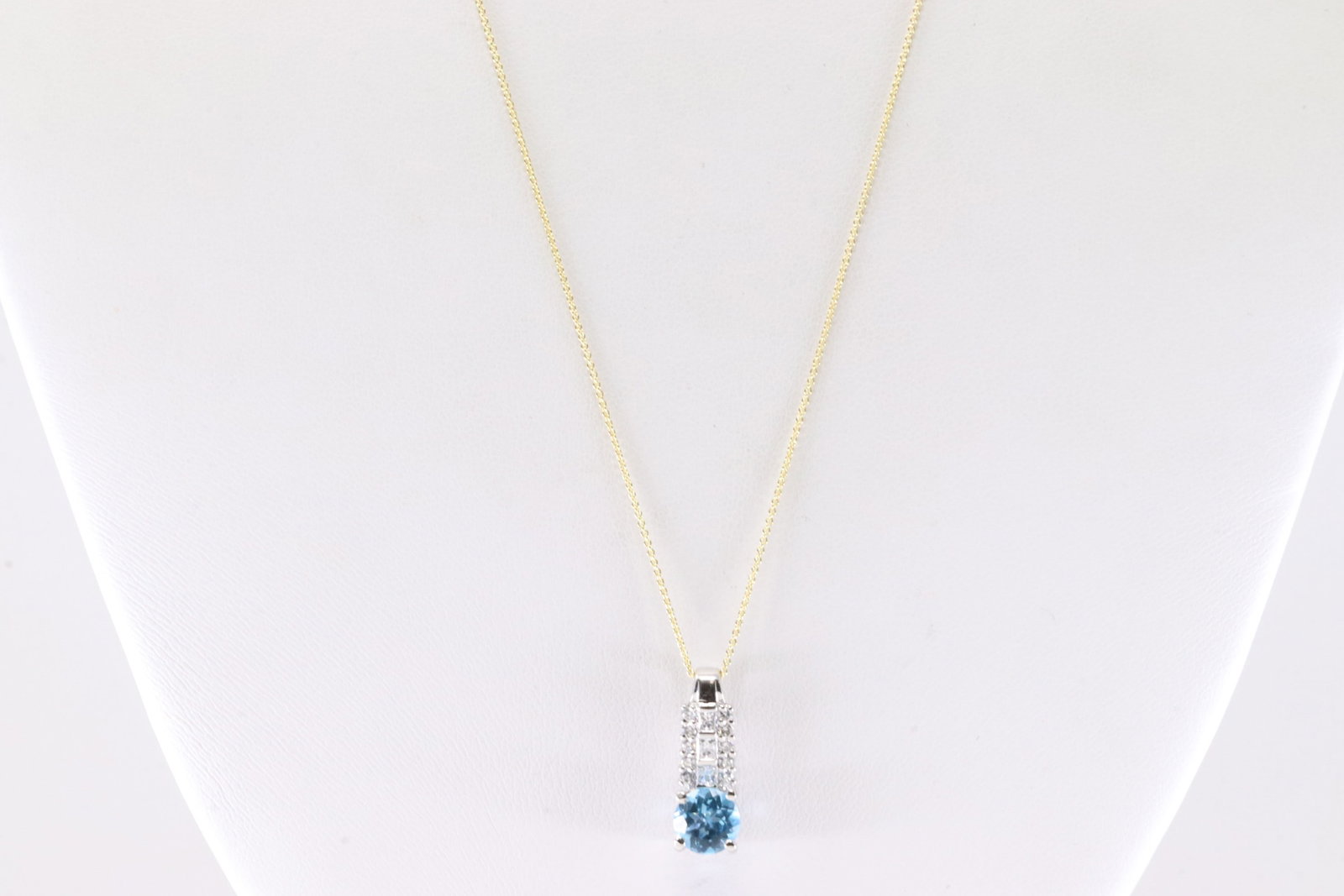 Blue Topaz & Diamond Pendant / Necklace 18Kt.: 18Kt White Gold Blue Topaz & Diamond Pendant / Necklace. This Charming Pendant has Blue Topaz Gemstone with Sparkling Diamonds And 14K Yellow Gold Necklace. Diamonds weight approx: 0.30 ctw Necklace l