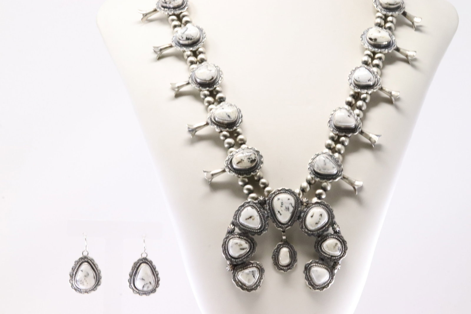 Native America Navajo Sterling Silver White Buffalo Squash Blossom Necklace & Earring's Set By: This is a Native America Navajo Sterling Silver White Buffalo Squash Blossom Necklace & Earring's Set By Thomas Francisco. Necklace length: 28.00" Total weight: 194.44 Grams.