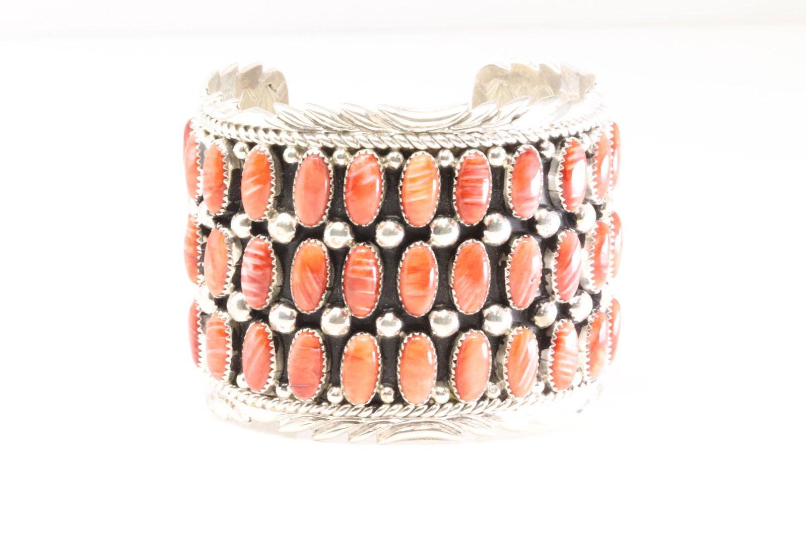 Native America Navajo Sterling Silver Coral Bracelet Cuff By B.J.: This is a Native America Navajo Sterling Silver Coral Bracelet Cuff By B.J. Total weight: 129. 26 Grams.