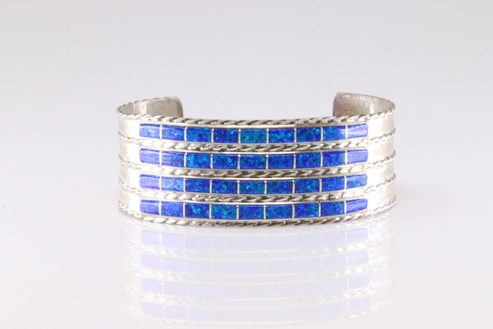 Native America Navajo Stearling Silver Blue Opal Inlay Bracelet Cuff By J.P.C.: This is a Native America Navajo Stearling Silver Blue Opal Inlay Bracelet Cuff By J.P.C. Stamp JPC.
