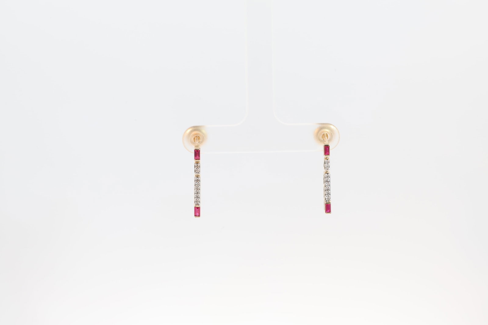 Ruby & Diamond Stud Earring 14Kt.: Ladies 14Kt Yellow Gold Ruby & Diamond Stud Earring. Earrig's has 4 Cut Ruby's Gems with 16 round Diamonds. Diamonds weight: 0.10ct. Ruby's weight: 0.26ct.