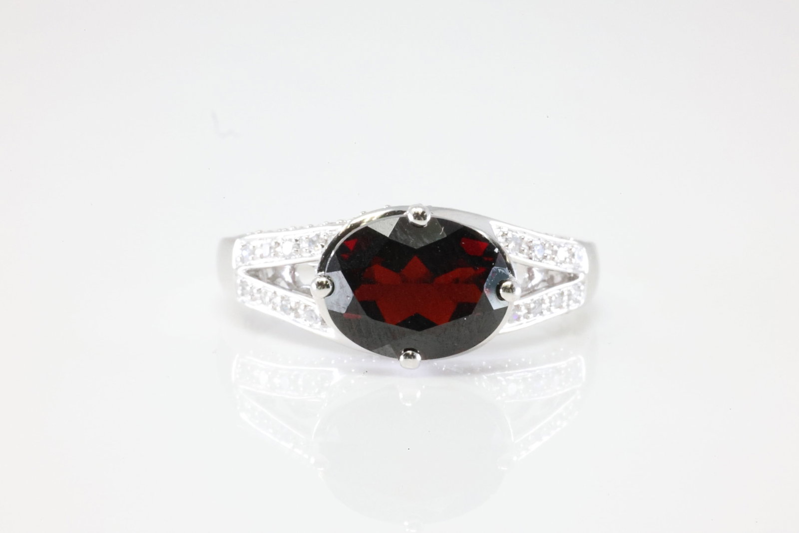 Garnet & Diamond Ring 14Kt.: Ladies 14Kt White Gold Garnet & Diamond Ring. This Ring has Gorgeous Garnet Gemstone With 42 Round Sparkling Diamonds. Ring Size: 7.00. Total Weight: 3.51 Grams.