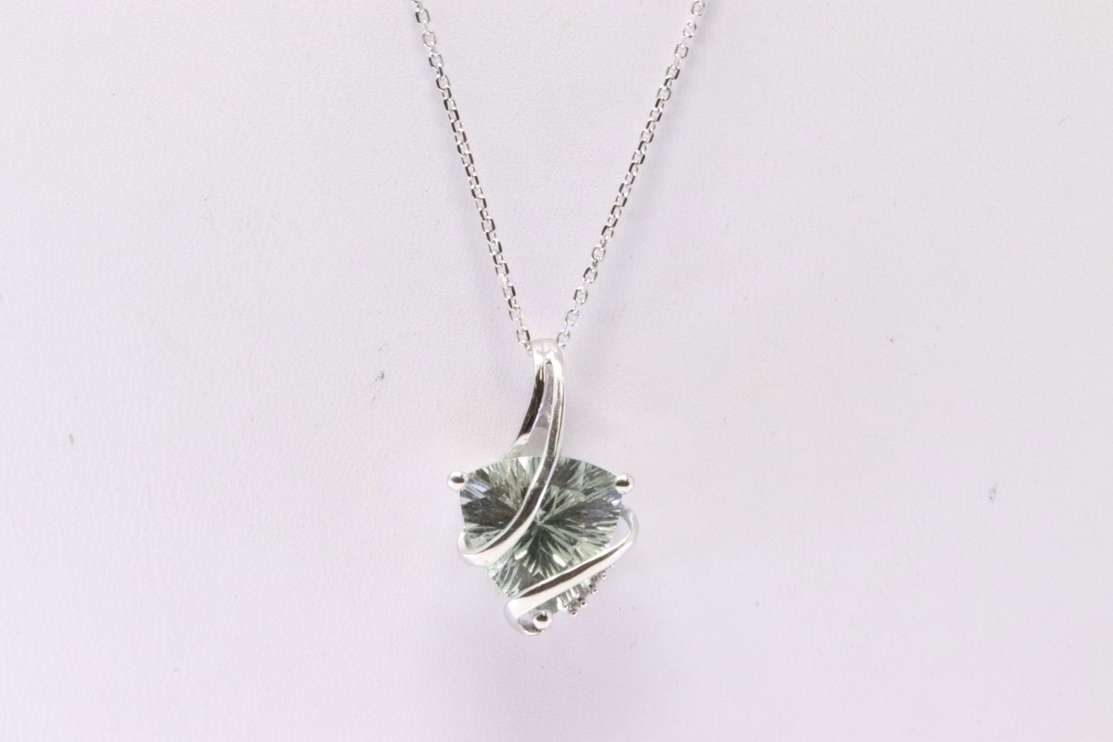 Quart & Diamond Pendant 14Kt.: 14Kt White Gold Quart & Diamond Pendant. Pendant has one Quartz with round Diamonds & A 14K Necklace. Necklace length: 18.00" Total weight: 4.60 Grams.