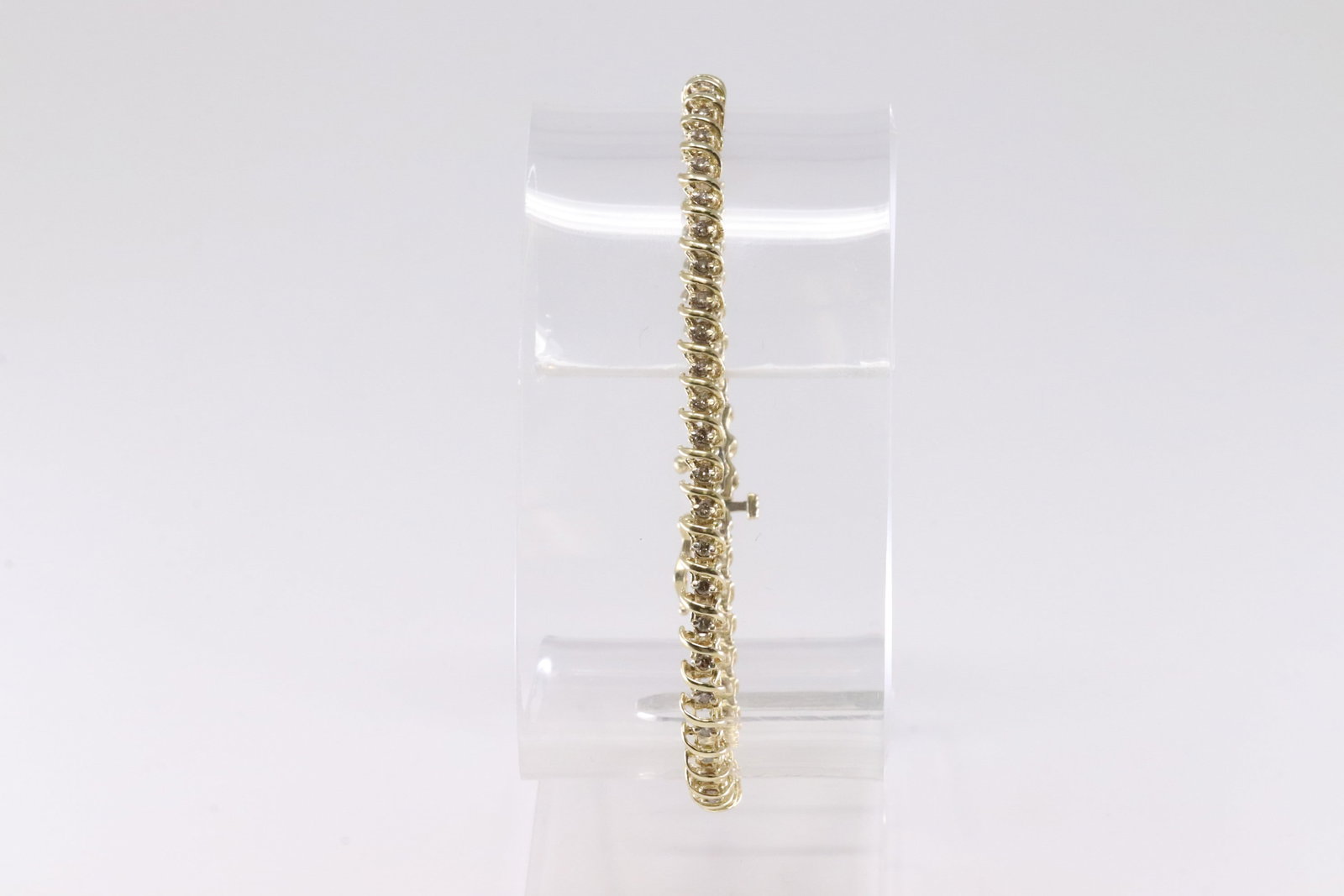 Diamond S Tennis Bracelet 14Kt.: 14Kt Yellow Gold Diamond S Tennis Bracelet. This Elegant Bracelet has S Design with 51 Sparkling Diamonds. Diamonds weight approx:1.00ctw. Bracelet length: 8.00" Total weight: 7.23 Grams.