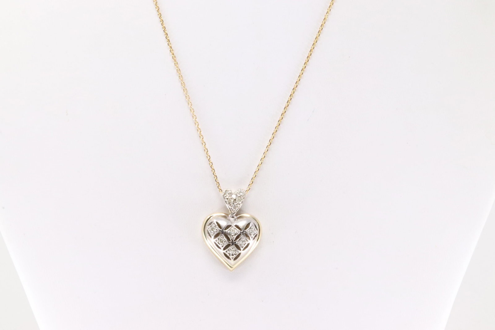 Diamond Heart Pendant / Necklace 14Kt.: 14Kt Yellow Gold Diamond Heart Pendant / Necklace. This beautiful heart pendant with 12 round diamonds and a 14k Necklace. Diamonds weight approx: 0.25ctw. Necklace length: 16.00" Total weight: 10.00