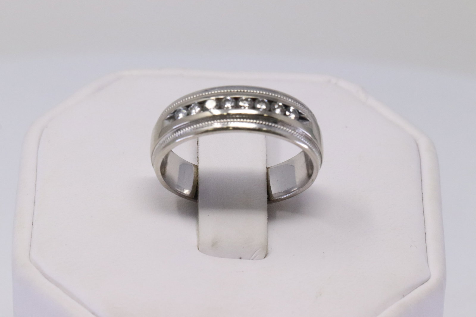14KT White Gold Diamond Ring.: 14KT White Gold Diamond Ring. Ring has in total 8 Diamonds side to side. Ring Size: 8.50. Total Weight: 6.05 Grams. Diamonds weight approx 0.25ctw.