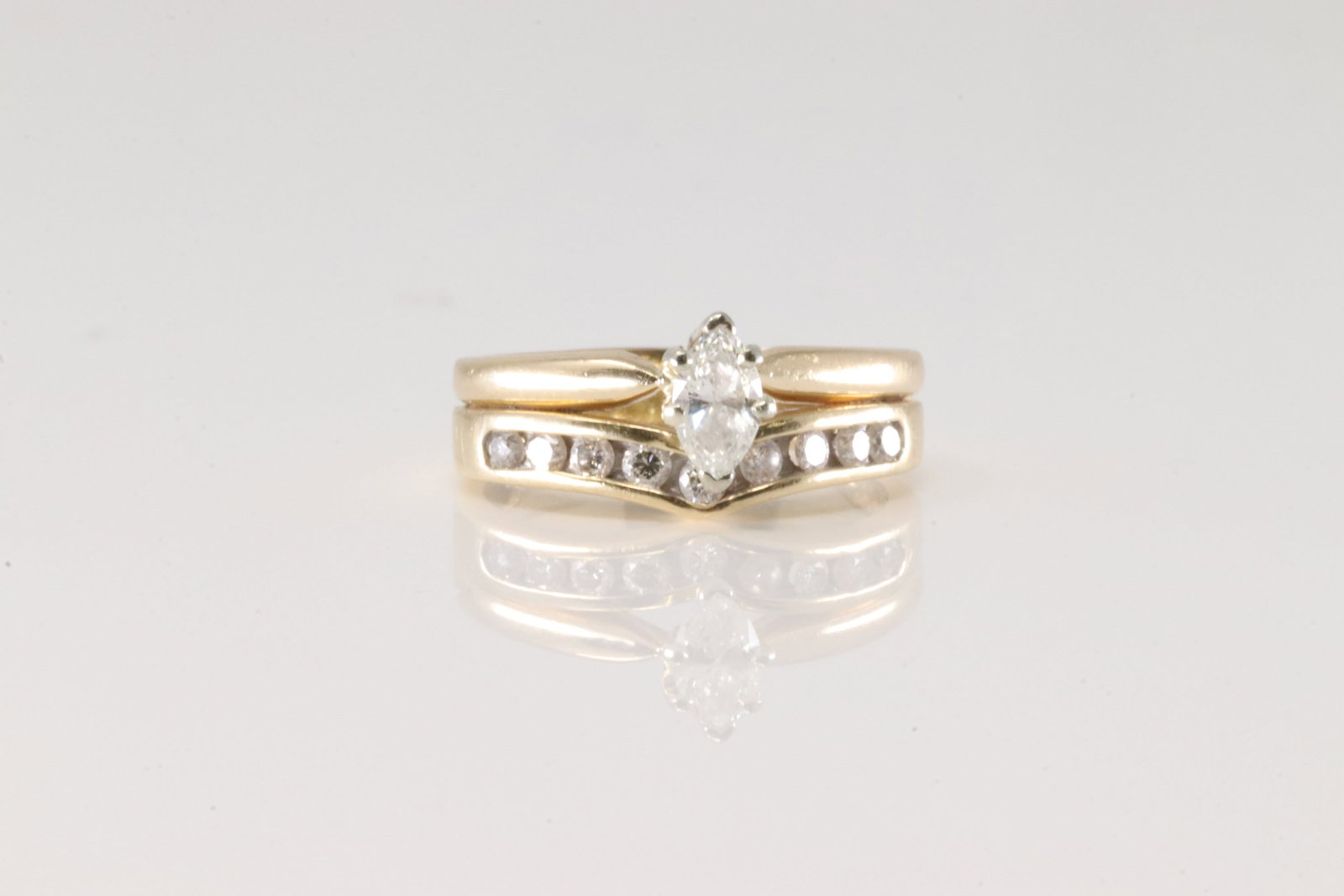 Double Band Marquise Diamond Ring 14Kt.: Ladies 14Kt Yellow Gold Double Band Marquise Diamodn Ring. This charming set band has wedding ring and engagement marquise ring. Total diamonds: 10 brilliants diamonds. Diamonds weight approx:0.50 ctw