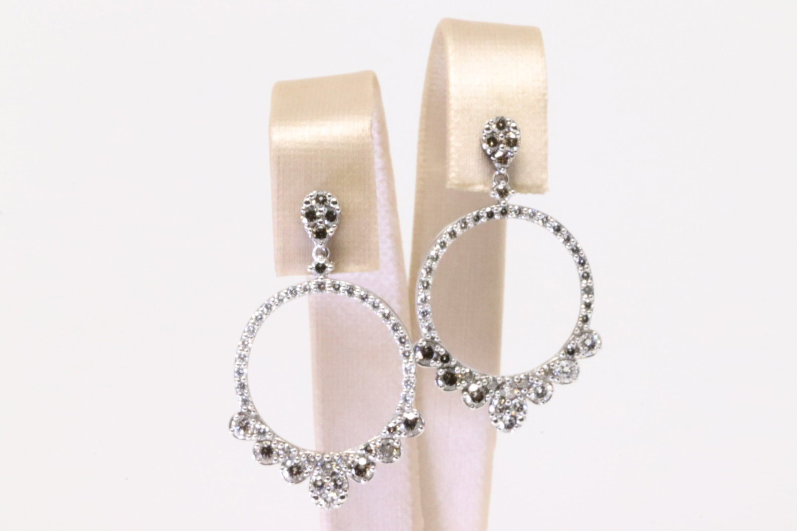14KT Diamond Earrings: A Unique 14kt White Gold Diamond earrings. Diamonds are set graduated style with around 80 round diamonds. Diamonds weigh approx 3.00cttw. Earrings length about 1.50in. Total weight: 6.10 grams.