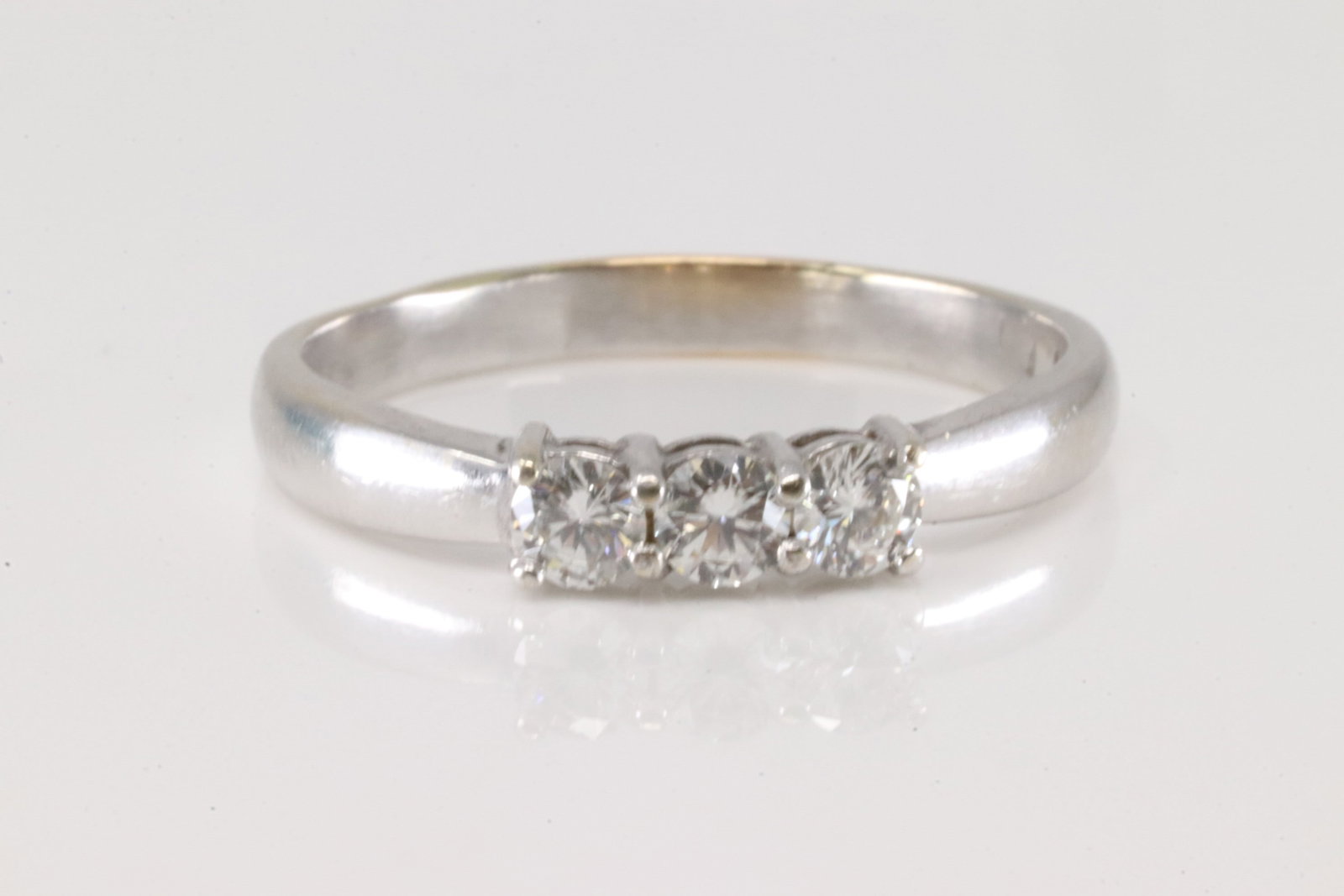 Diamond Ring 14Kt.: Ladies 14Kt White Gold Diamond Ring. This band ring has 3 brilliants diamonds. Diamonds weight approx: 0.30ctw. Ring size: 9.00. Total weight: 3.40 Grams.