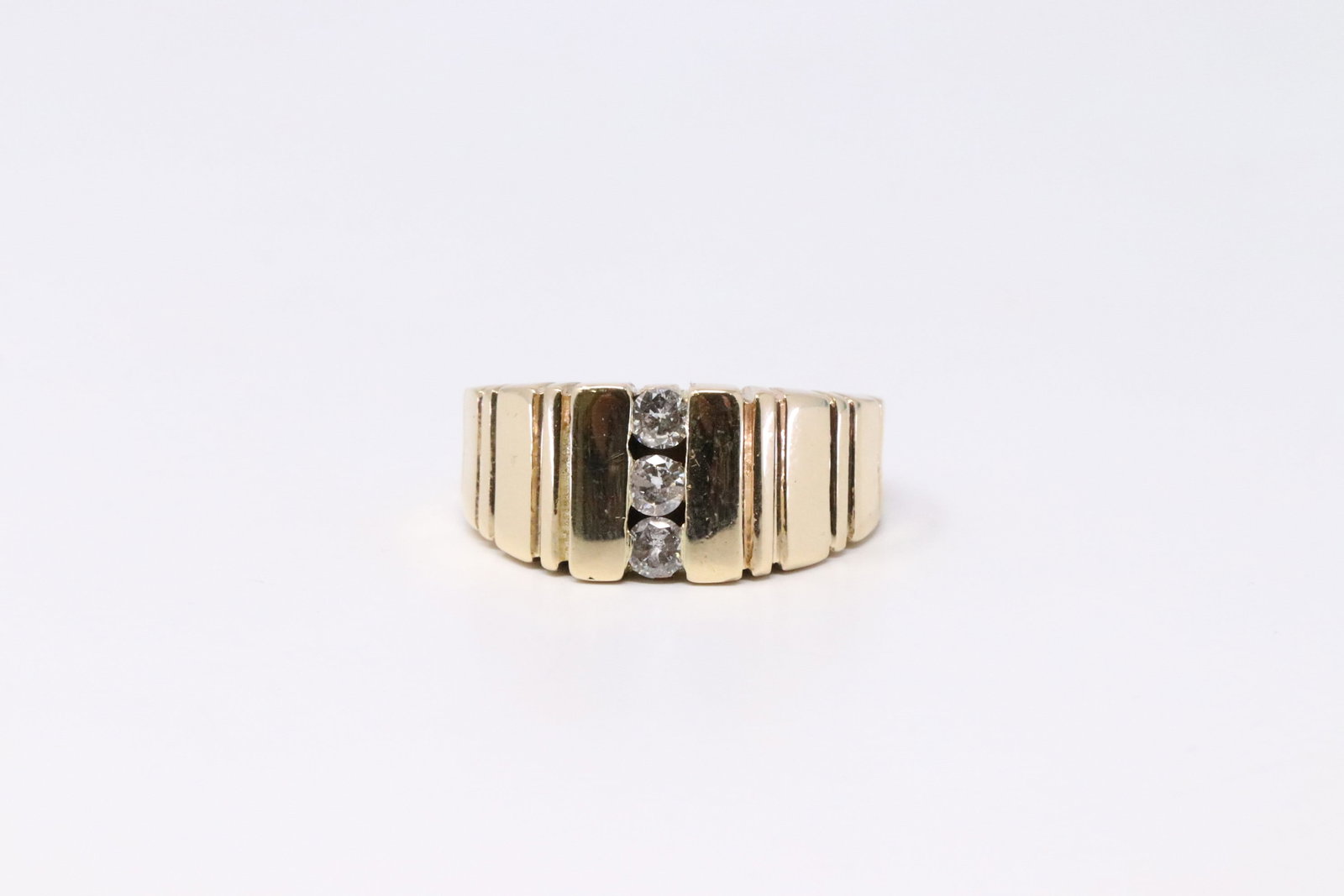 14KT Yellow Gold Diamond Ring.: 14kt Yellow Diamong Ring. Ring has total of 3 round diamonds. Diamonds weight approx: 0.25ctw. Ring Size: 7.25. Total Weight : 8.44 grams.