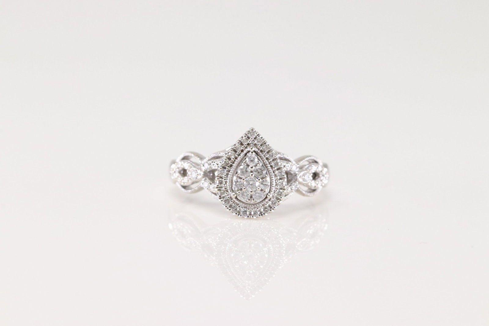 Engagement Diamond Ring 10Kt.: Ladies 10Kt White Gold Engagement Diamond Ring. This Elegant Ring has Pear-Shape Design with Sparkling Diamonds. Diamonds weight approx: 1.00 ctw Ring size: 7.00. Total weight: 3.60 Grams.