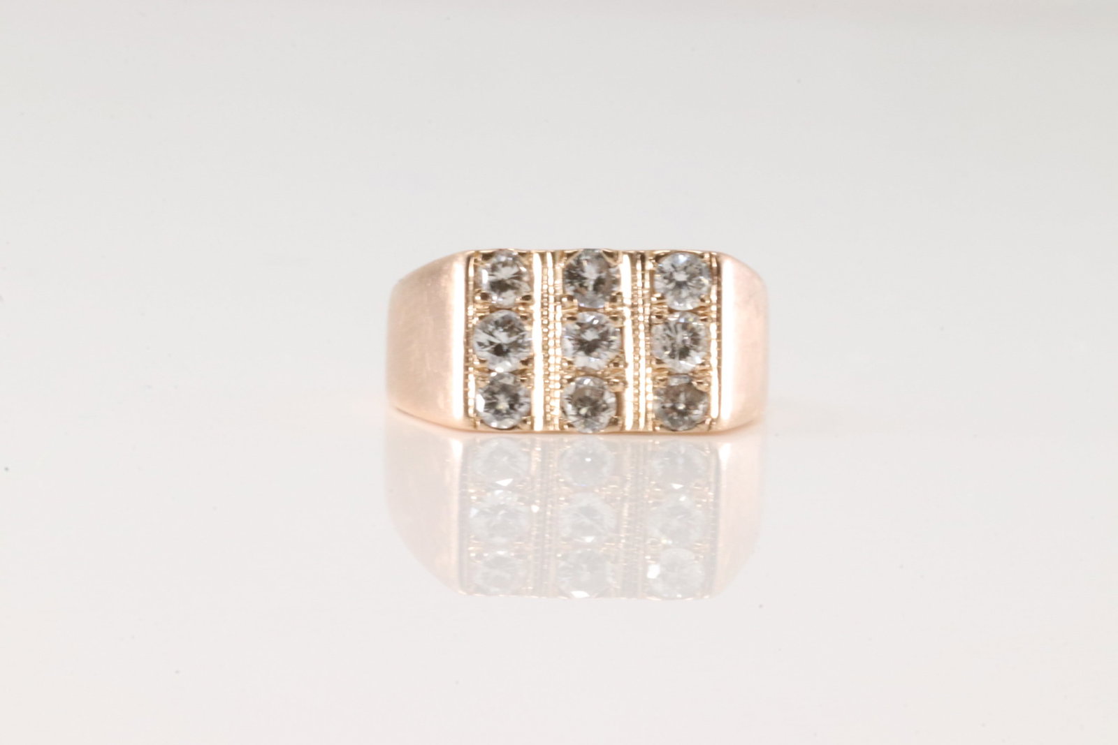 Diamond Ring 14Kt.: 14Kt Rose Gold Diamond Ring. This ring has 3 rows with 9 sparkling diamonds. Ring size: 6.00. Total weight: 4.50 Grams.
