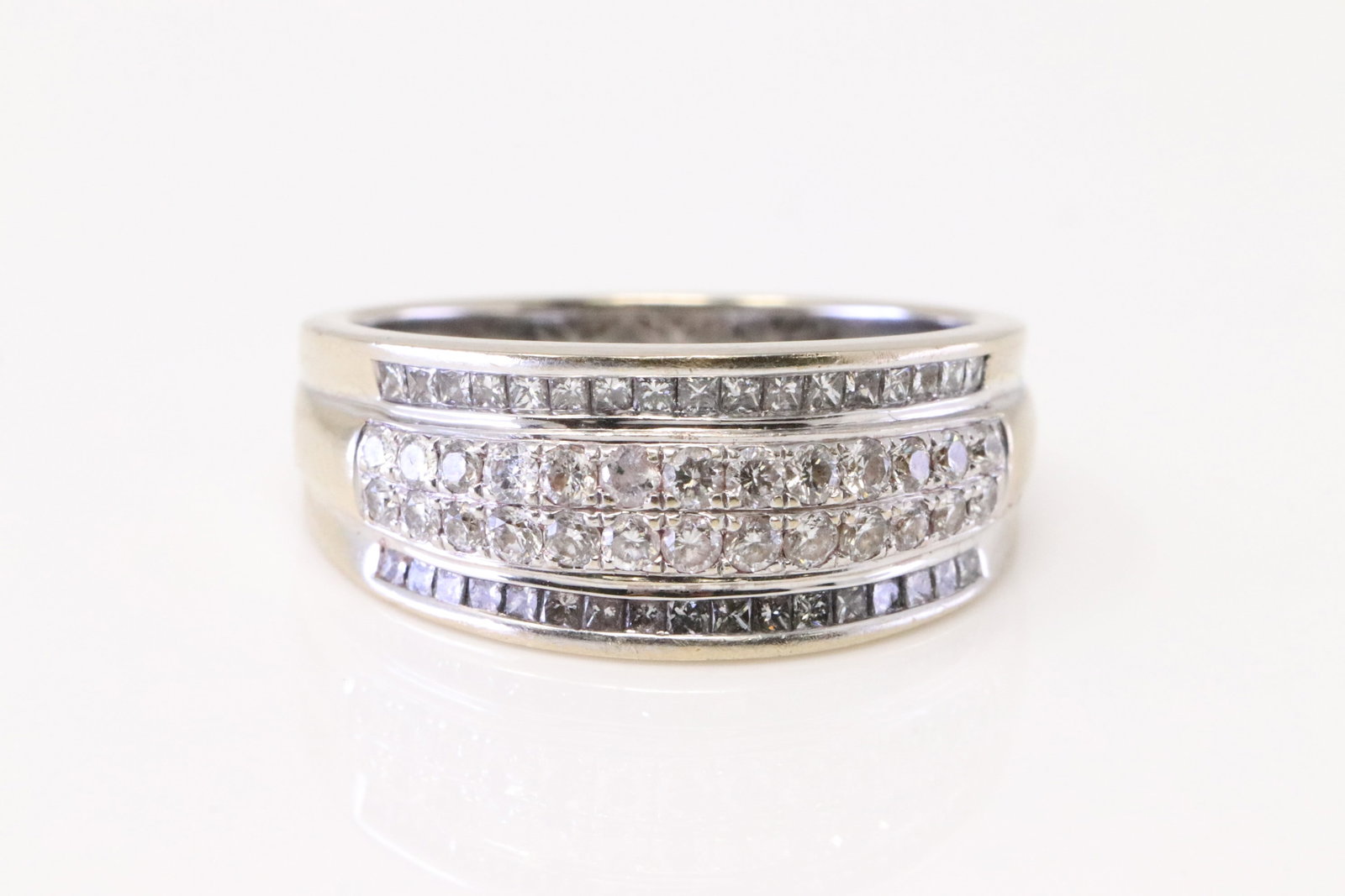 Diamond Ring 18Kt.: Ladies 18Kt White Gold Diamond Ring. Ring has 4 Row with 60 Diamonds. Diamonds weight approx: 1.50ctw. Ring size: 6.75. Total weight: 5.60 Grams.