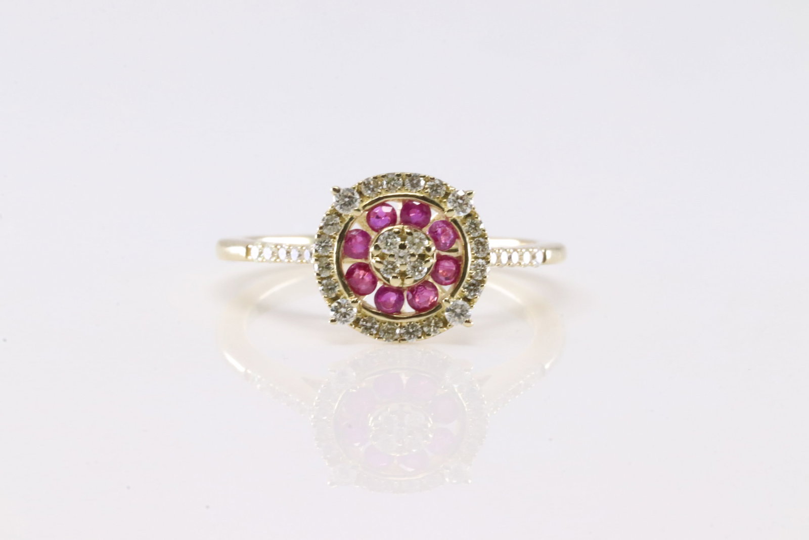 Ruby & Diamond Ring 10Kt.: Ladies 10Kt Yellow Gold Ruby & Diamond Ring. This Ring has 8 Gorgeous Ruby Gemstones With 30 Round Sparkling Diamonds. Diamond Approx Weight: 0.25 ctw. Ring Size: 6.50. Total Weight: 2.15 Grams.