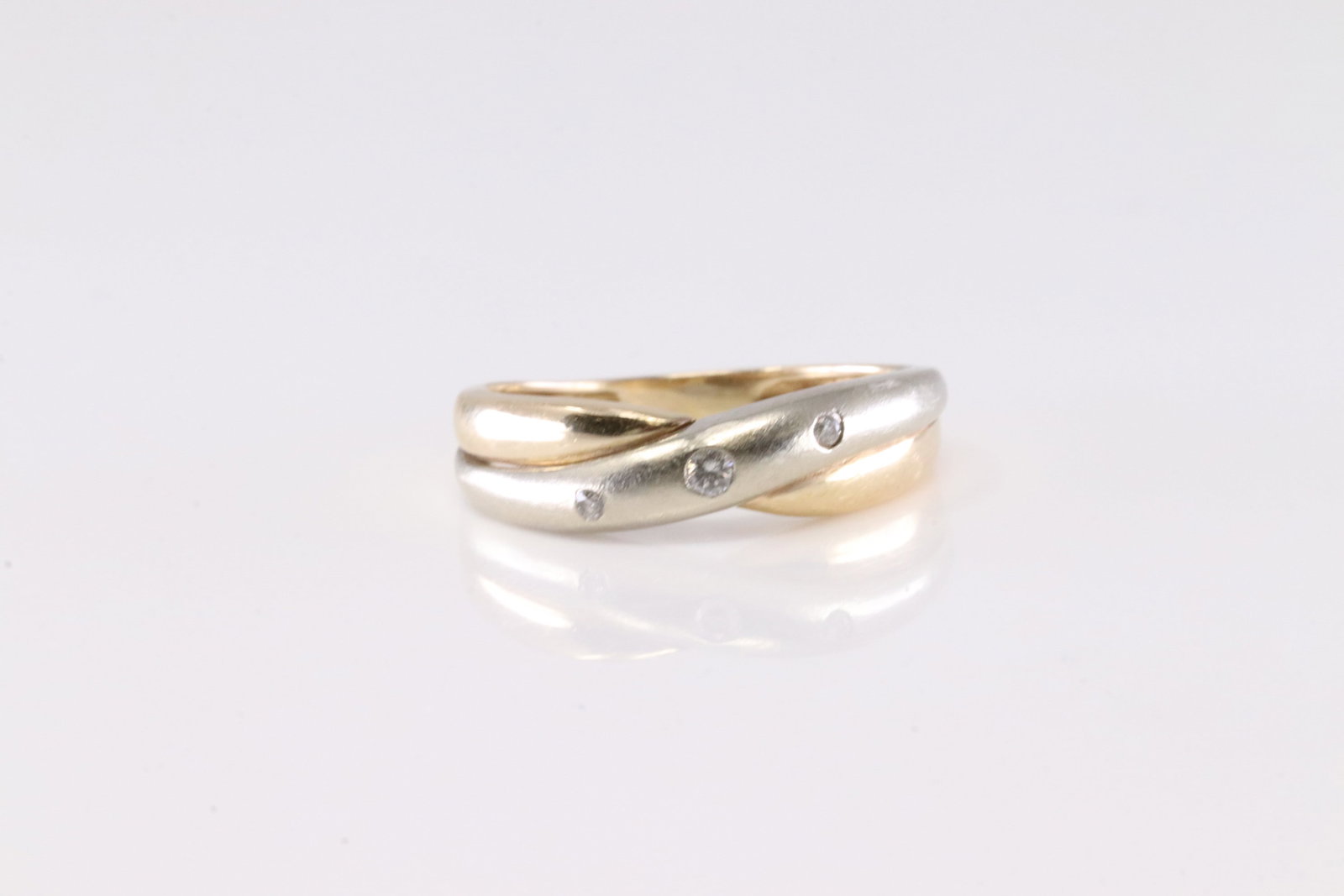 Diamond Ring 14Kt.: Ladies 14Kt Yellow Gold Diamond Ring. This Cgarming Ring has White & Yellow Gold with 3 Sparkling Diamonds. Ring size: 6.75.