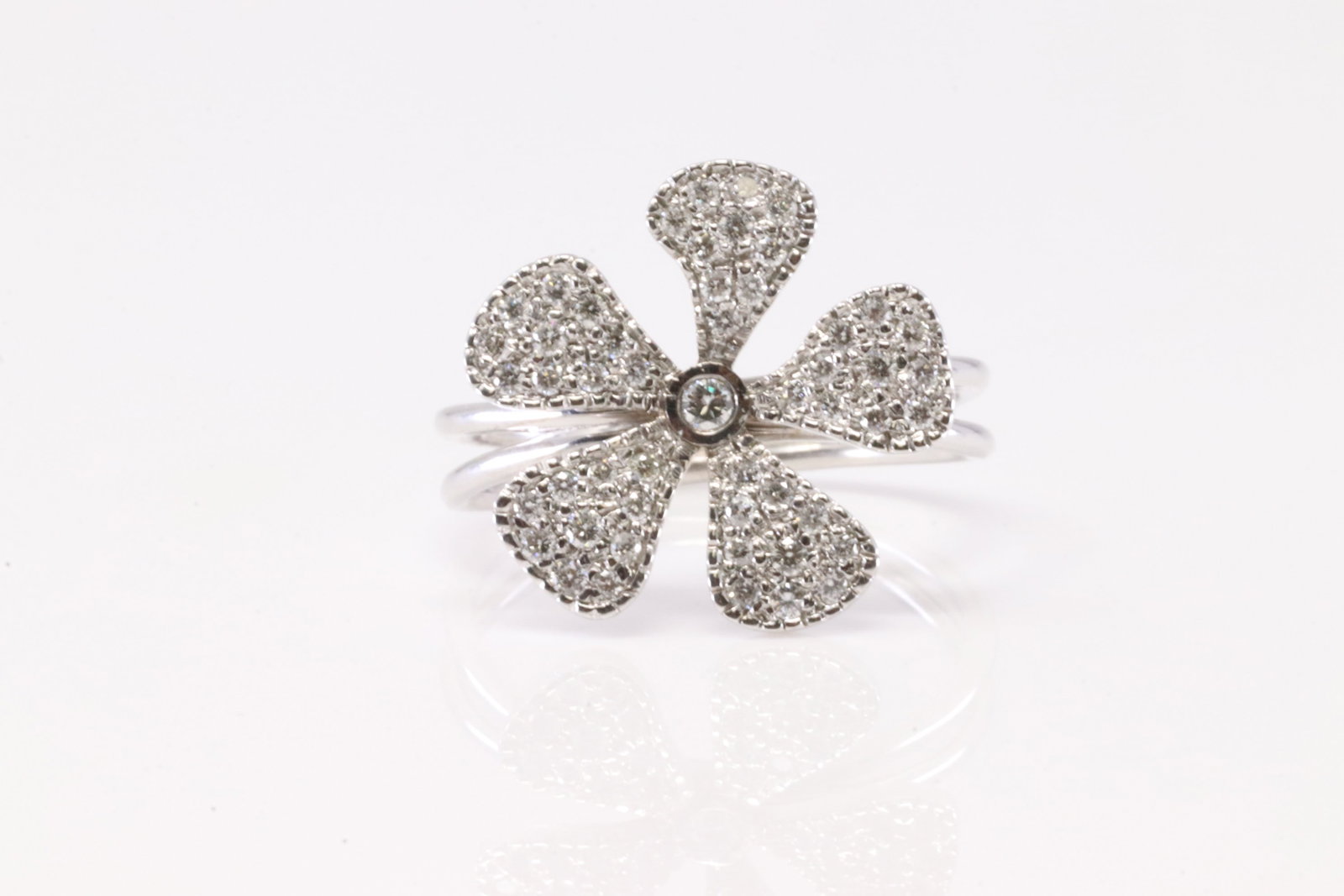 Diamond Ring 14Kt.: Ladies 14Kt White Gold Diamond Ring. This Ring has Beautiful Flower Design With Sparkling Diamonds. Diamond Approx Weight: 0.55ctw. Ring Size: 8.00. Total Weight: 4.15 Grams.