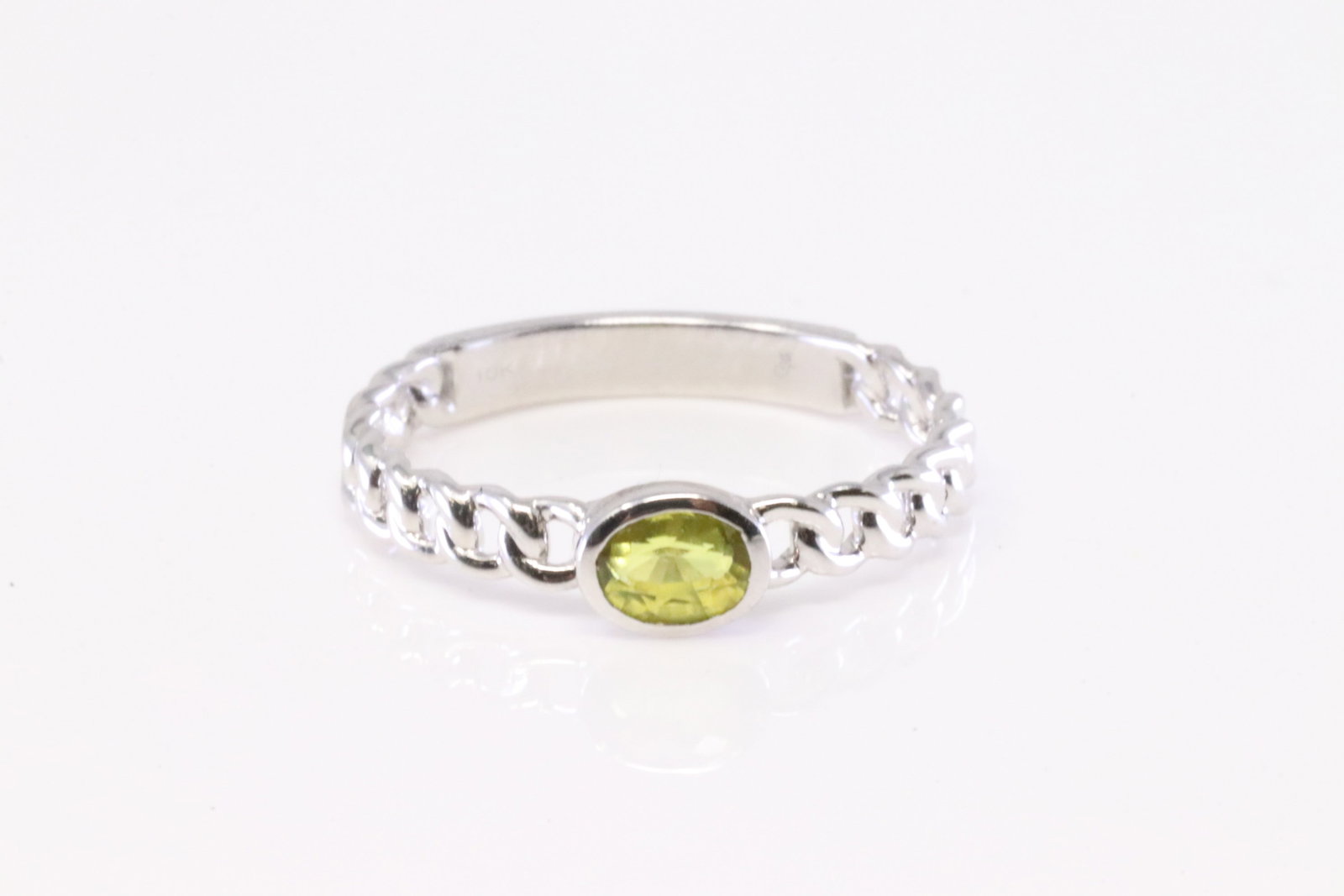 Yellow Stone Ring 10Kt.: Ladies 10Kt White Gold Yellow Stone Ring. Ring has Oval Yellow Stone. Ring size: 7.00. Total weight: 2.00 Grams.