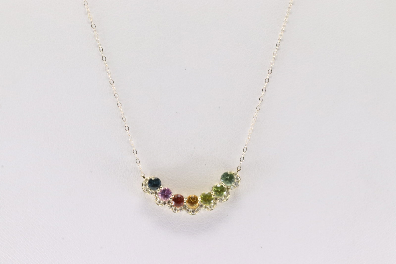 Rainbow & Diamond Pendant / Necklace 10Kt.: Ladies 10Kt Yellow Gold Rainbow & Diamond Pendant / Necklace. This Necklace has A Rainbow Station Pendant With 30 Round Sparkling Diamonds. Diamond Approx Weight: 0.18 ctw. Necklace Length: 18.00.