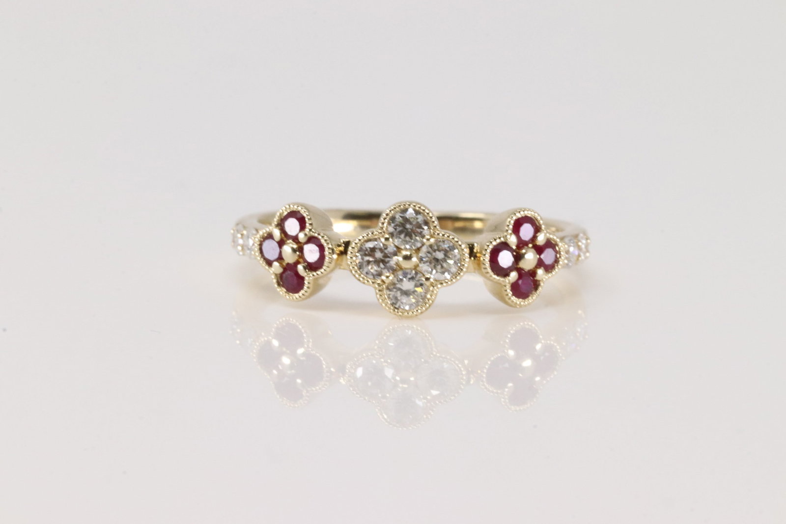 Ruby & Diamond Ring 14Kt.: Ladies 14Kt Yellow Gold Ruby & Diamond Ring. This Charming Ring has 3 Fflower Design with Pink Rubies and Sparkling Diamonds. Diamonds weight: 0.26ctw. Rubies weight: 0.26ctw. Ring size: 6.50.