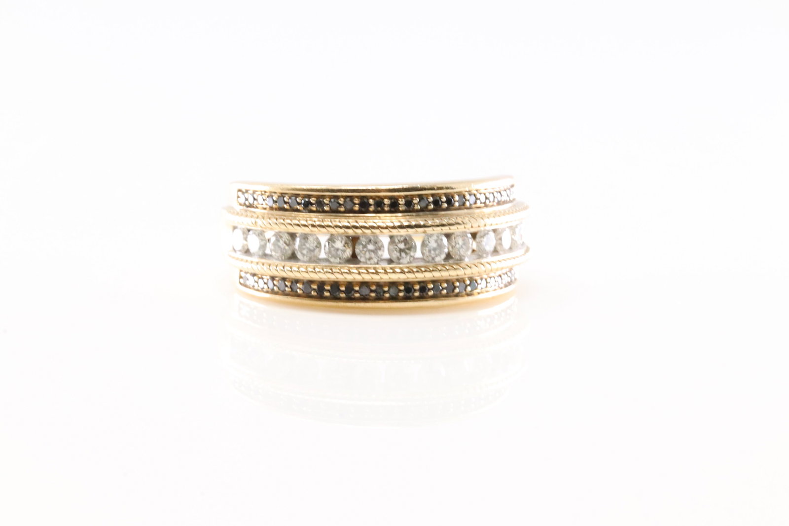 Black Onyx & Diamond Ring 10Kt.: Ladies 10Kt Yellow Gold Black Onyx & Diamond Ring. This Ring has 52 Black Gemstones With 13 Round Sparkling Diamonds. Diamond Weight Approx: 1.00 ctw Ring Size: 10.50. Total Weight: 7.54 Grams.