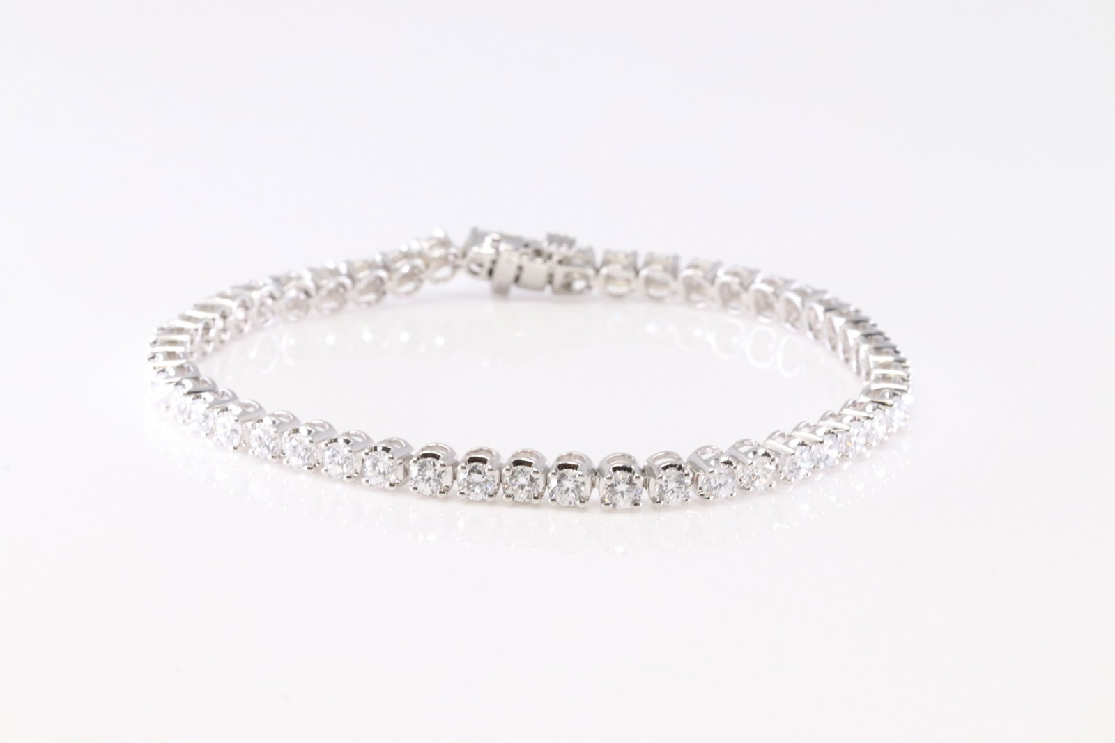 Diamond Bracelet 14Kt.: Ladies 14Kt White Gold Diamond Bracelet. This Elegant Bracelet has Lab-grown Diamonds ( 49 Diamonds) . Diamond Approx Weight: 2.50 ctw Bracelet Length: 15.00. Total Weight: 9.57 Grams.