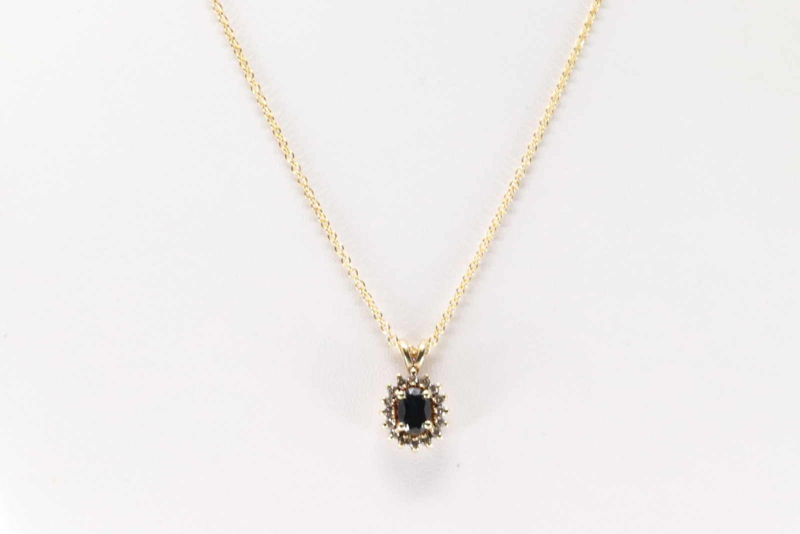 Sapphire & Diamond Pendant / Necklace 14Kt.: Ladies 14Kt Yellow Gold Sapphire & Diamond Pendant / Necklace. This Charming Pendant has Oval Sapphire with Sparkling Diamonds and A 14Kt. Necklace length: 16.00" Total weight: 4.10 Grams.