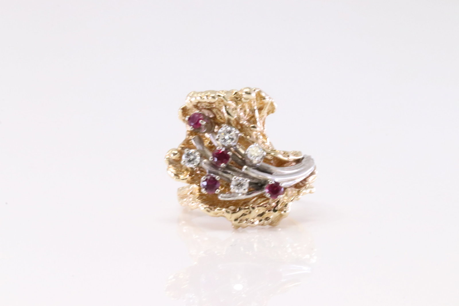 Ruby & Diamond Ring 14Kt.: Ladies 14Kt Yellow Gold Ruby & Diamond Ring. Ring has Tree Design with round Ruby's & 4 Diamonds. Diamonds weighta approx: 0.15ctw. Ring size: 6.50. Total weight: 11.20 Grams.