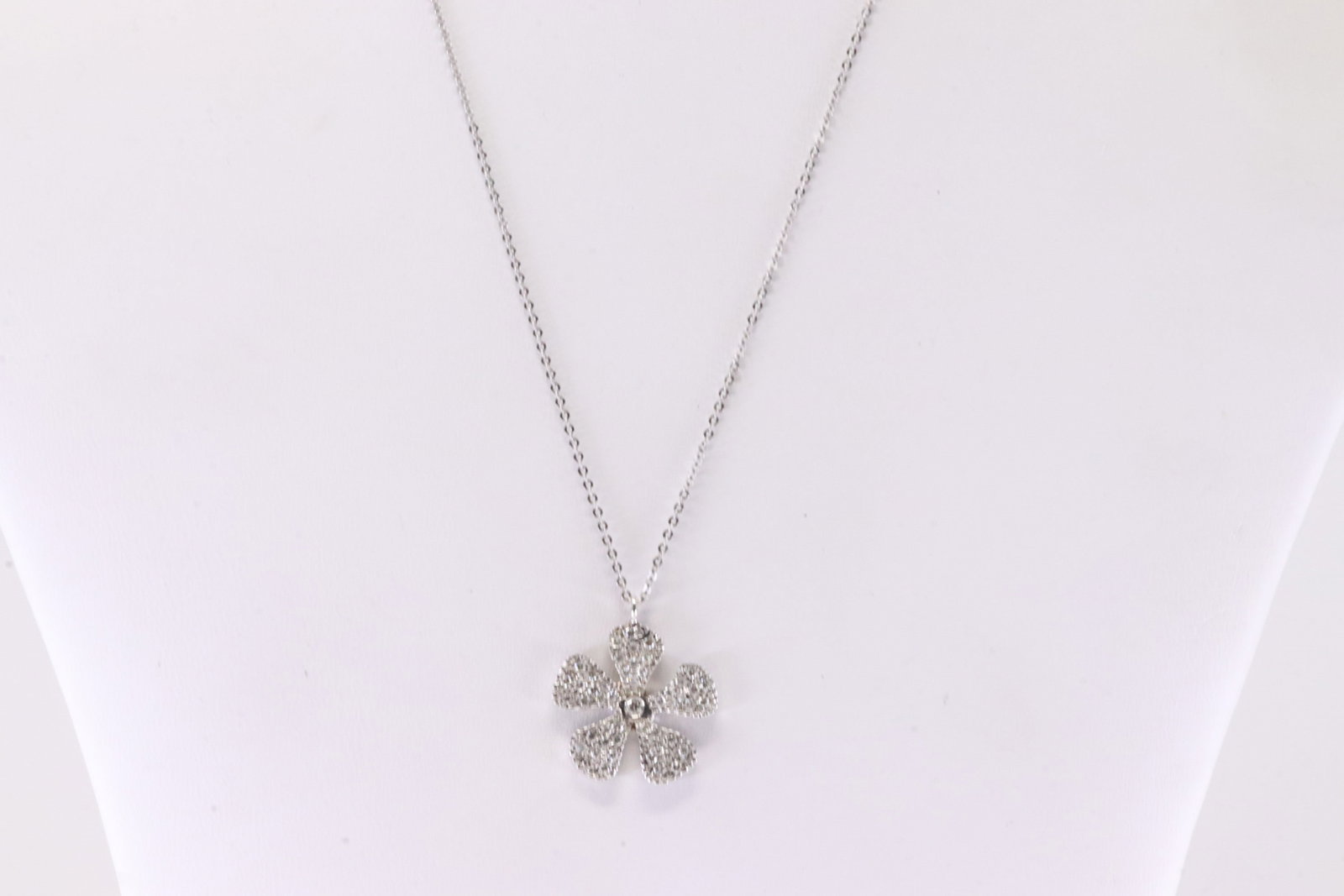 Diamond Pendant / Necklace 14Kt.: Ladies 14Kt White Gold Diamond Pendant / Necklace. This Necklace has A Beautiful Flower Pendant With Sparkling Diamonds. Diamond Approx Weight: 0.55ctw. Necklace Length: 18.00. Total Weight: 3.48
