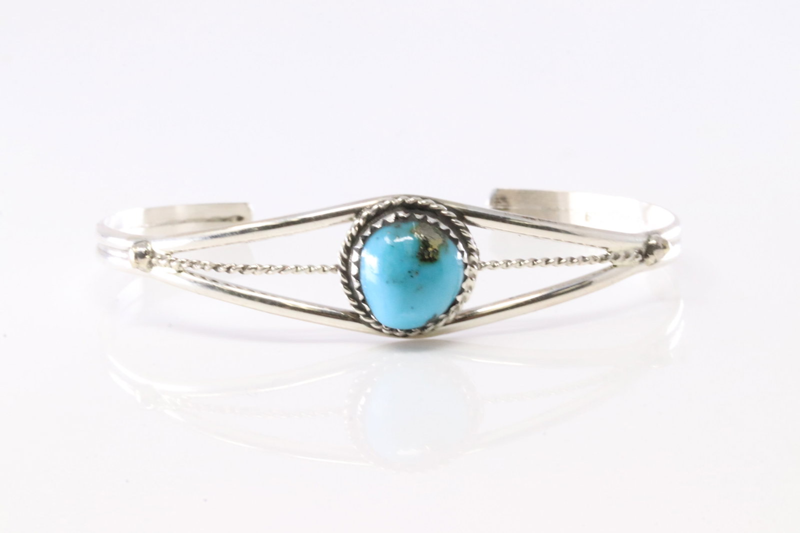 Native America Navajo Sterling Silver Turquoise Bracelet Cuff By EW.: This is a Native America Navajo Sterling Silver Turquoise Bracelet Cuff By EW. Stamp EW.