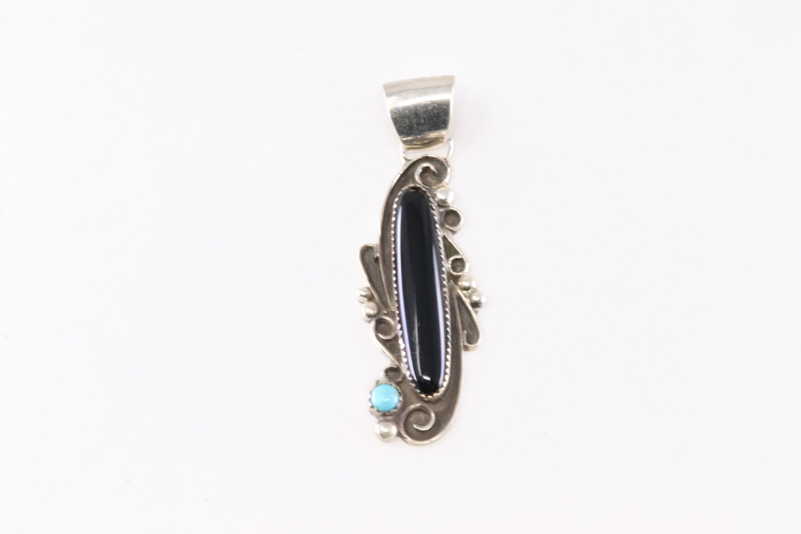 Native America Navajo Sterling Silver Black Onyx & Turquoise Pendant By Susan Yazzie.: This is a Native America Navajo Sterling Silver Black Onyx & Turquoise Pendant By Susan Yazzie.