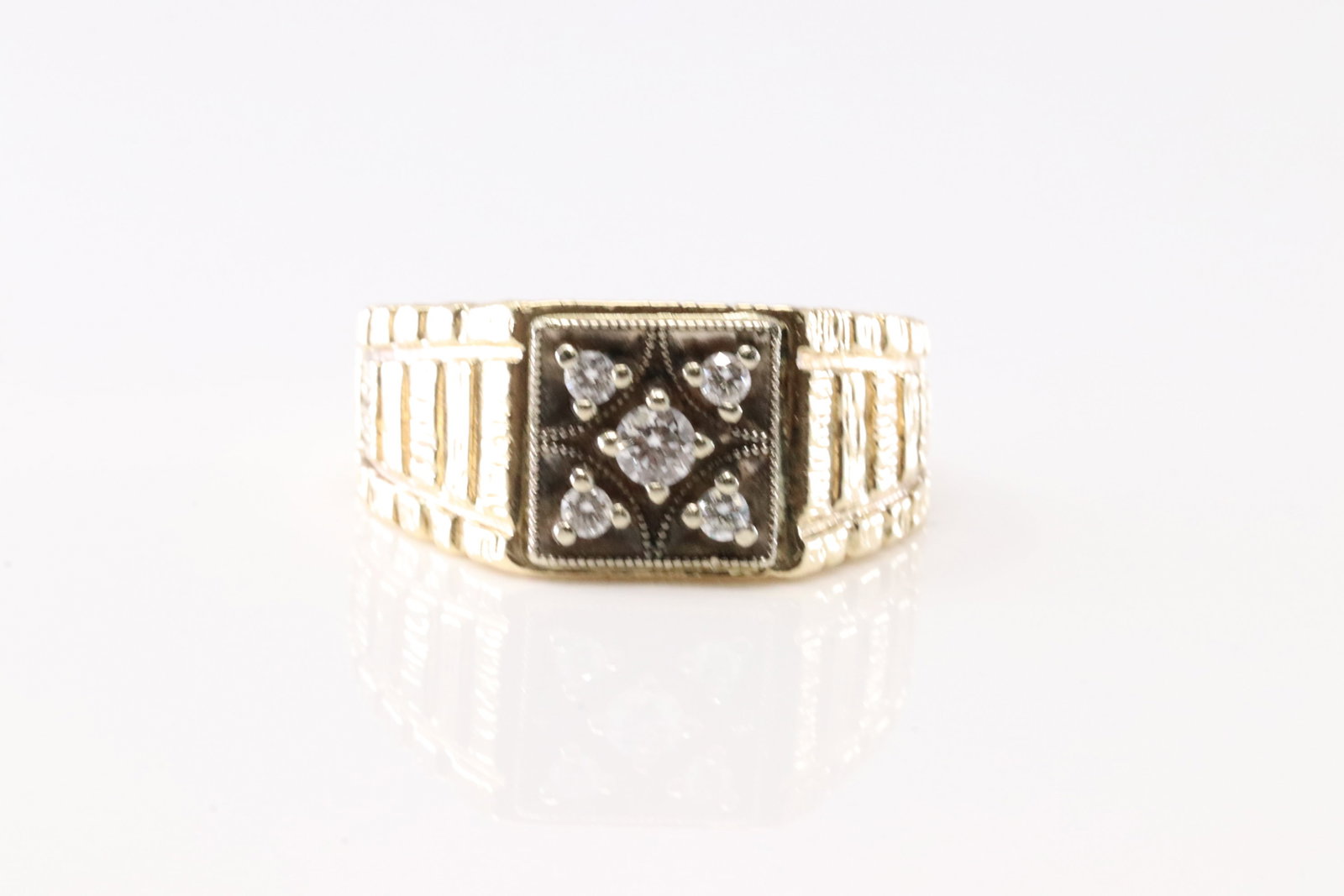 Diamond Ring 10Kt.: Ladies Yellow Gold Diamond Ring. This Elegant Ring has 5 Round Sparkling Diamonds. Ring Size: 9.50. Total Weight: 9.35 Grams.