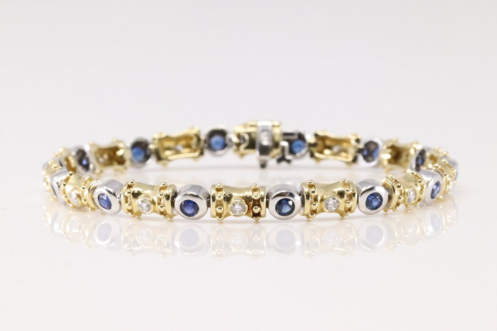 Sapphire & Diamond Bracelet 14Kt.: Ladies 14Kt Yellow Gold Sapphire & Diamond Bracelet. This Elegant Bracelet has 14 Beautiful Sapphire Gems & 14 Round Sparkling Diamonds. Diamonds Approx Weight: 0.50 ctw Bracelet Length: 7.5 inches.