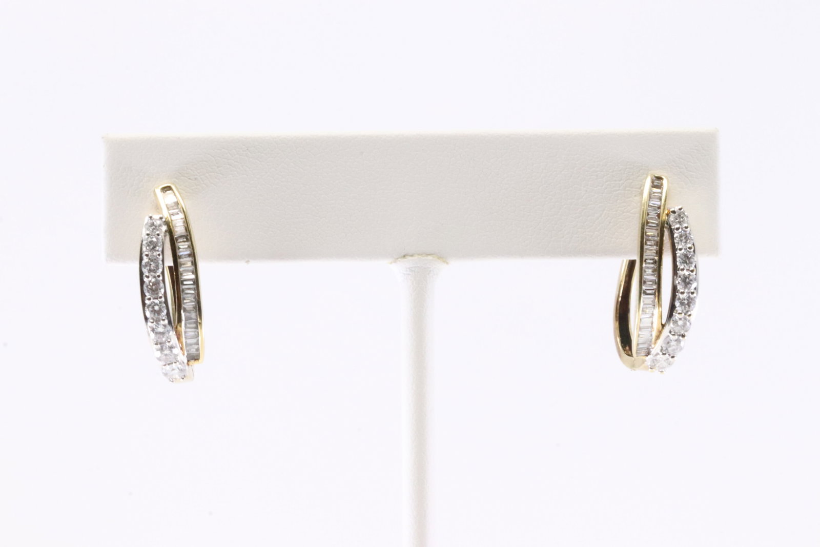 Diamond French Clip Hoop Earring 10Kt.: Ladies 10Kt Yellow Gold Diamond French Clip Hoop Earring. This Elegant Hoop Earring's has Baguette & round Diamonds. Diamonds weight approx: 2.00ctw. Total weight: 3.59 Grams.