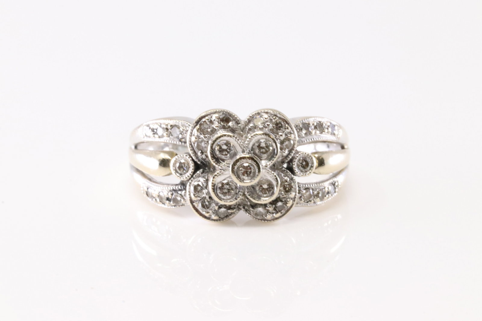 Diamond Ring 14Kt.: Ladies 14Kt White Gold Diamond Ring. This Gorgeous Ring has Flower Design With 31 Round Sparkling Diamonds. Diamond Approx Weight: 0.35 ctw Ring Size: 7.50. Total Weight: 5.00 Grams.