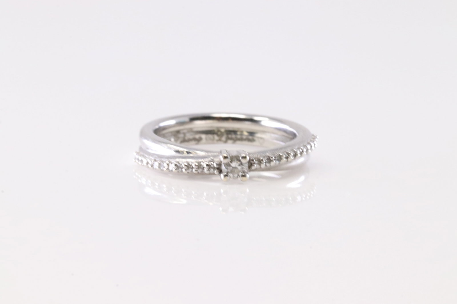 Diamond Double Band Ring 10Kt.: Ladies White Gold Diamond Double Band Ring. This Charming Ring has Double Band With 23 Round Sparkling Diamonds. Ring Size: 3.00.