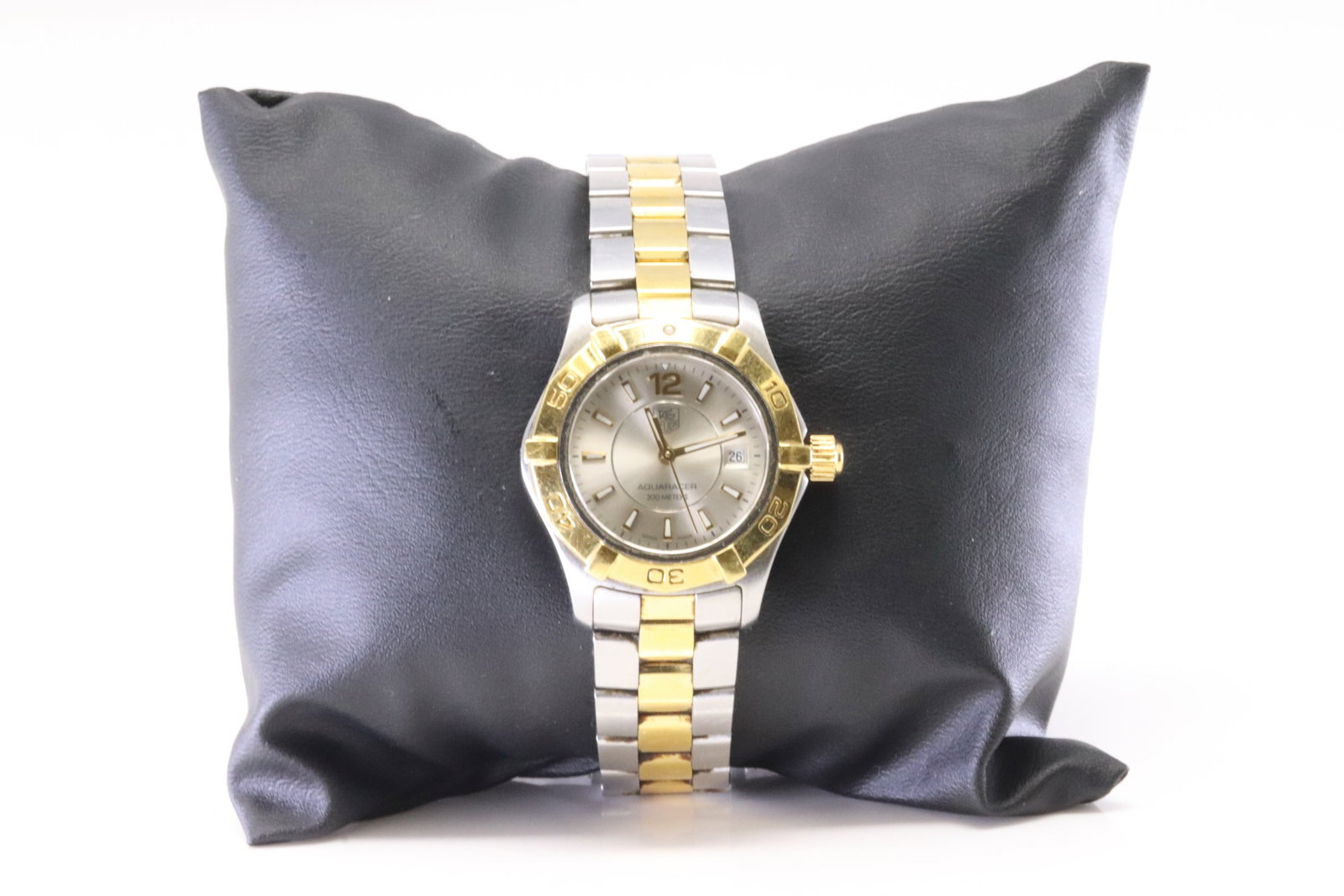 Tag Heuer Watch Aquaracer 18Kt.: 18Kt Women Tag Heuer Watch Aquaracer. Aquaracer Professional 300 Date White Mother of Pearl Dial 18K Yellow Gold Plated and Steel Women's Watch VU8805. Hour Markers with Minute Around And The Date.