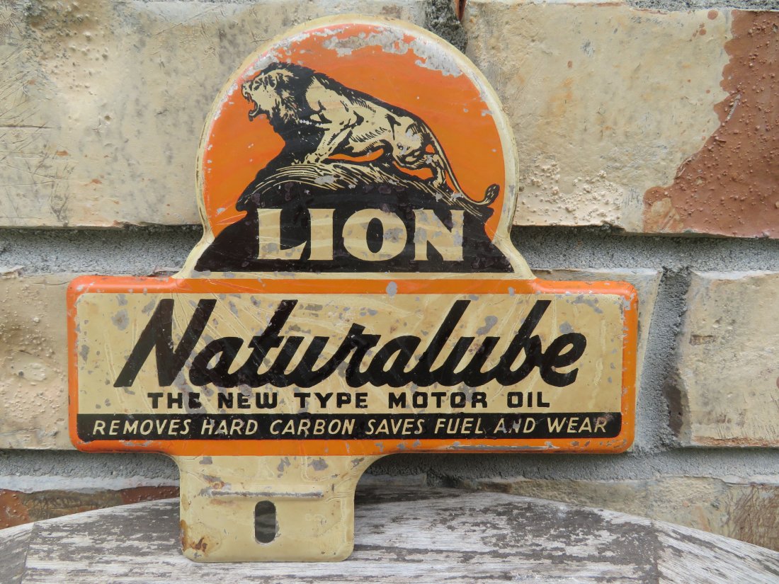 Vintage Lion Oils License Plate Topper: Appears to be made out of tin. Measures 6 by 6 inches.