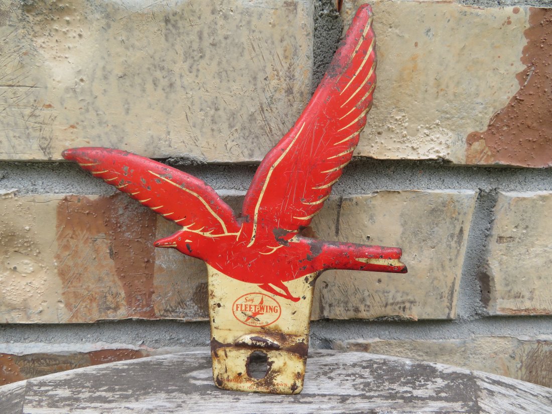 Vintage Fleet Wing License Plate Topper: Appears to be made of tin. Measures 5.5 by 6 inches.