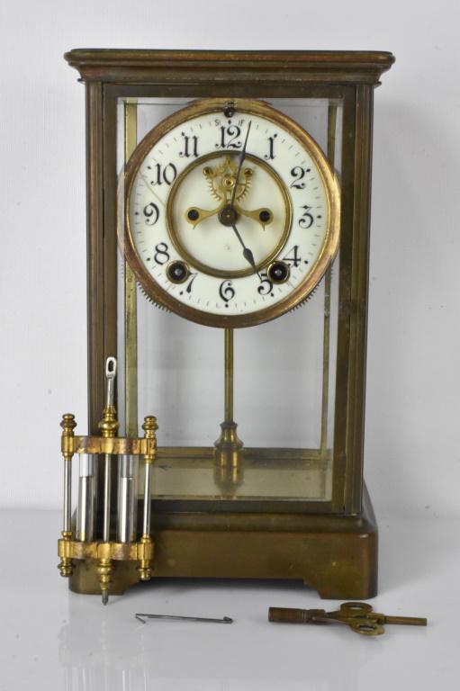 Ansonia Crystal Regulator Clock: Brass and Crystal regulator clock, with painted dial and open escapement, constructed of brass and beveled glass panels, comes with key and pendulum (appears to be mercury filled), chapter ring has ha