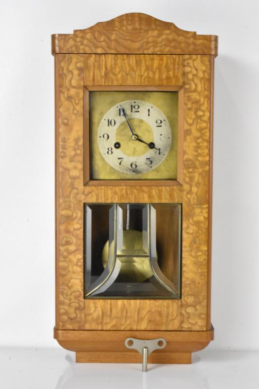 Continental regulator wall Clock: Includes original pendulum and key. Clock appears to be in good order working condition is unknown. Provenance: Private collection from a retired Catholic Priest. measures aprrox. 23"H x 11"L x 5"W