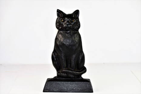 Heavy Antique Cast Iron Black Cat Door Stop: Heavy Cast-Iron Doorstop Piece featuring Black Cat with Glass Eyes. Maker Stamp on Back. Measures approx. 12.75"h, 7.75"w.