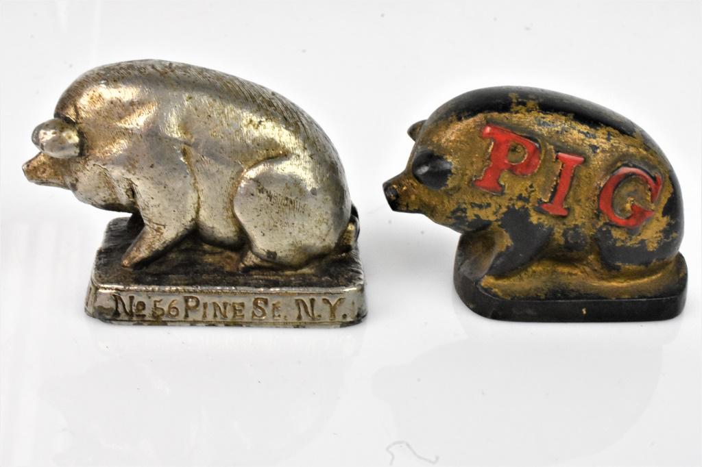 Pair of Cast Iron Pig Advertising paperweights (1 of 5)