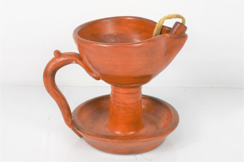 Slip-glazed Moravian Redware Grease/Lard Oil Lamp: 19th Century Moravian Redware Lard Oil Lamp, with Single Spout and Wick Support. Includes Wick. Handle has been repaired. Measures approx. 6"h on 4.5" diameter Base.